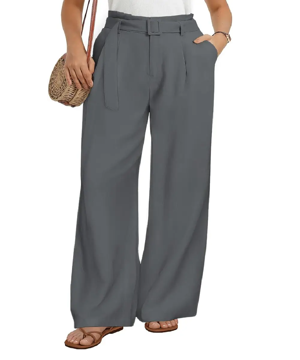 A woman wearing grey, high-waisted, wide-leg trousers with a paperbag waist and a decorative belt, paired with sandals.