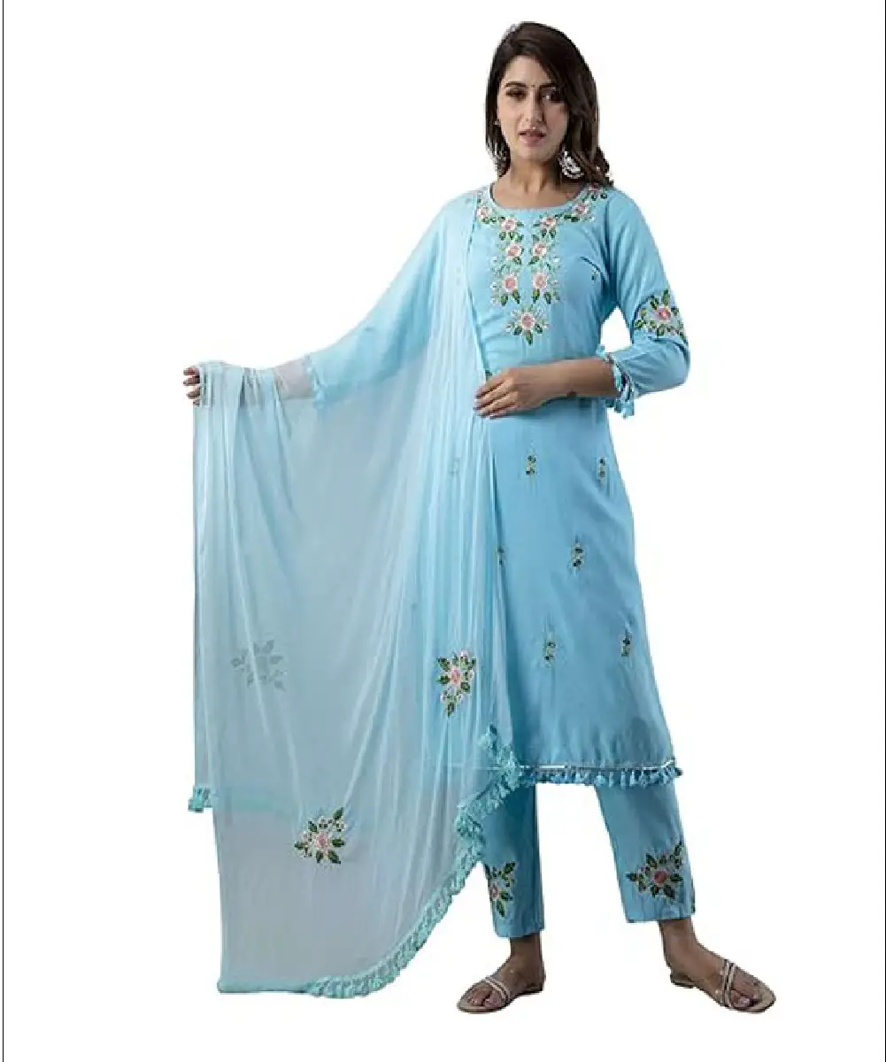 A woman wearing a mustard yellow georgette Anarkali-style kurta with delicate embroidery, paired with matching pants and a dupatta.