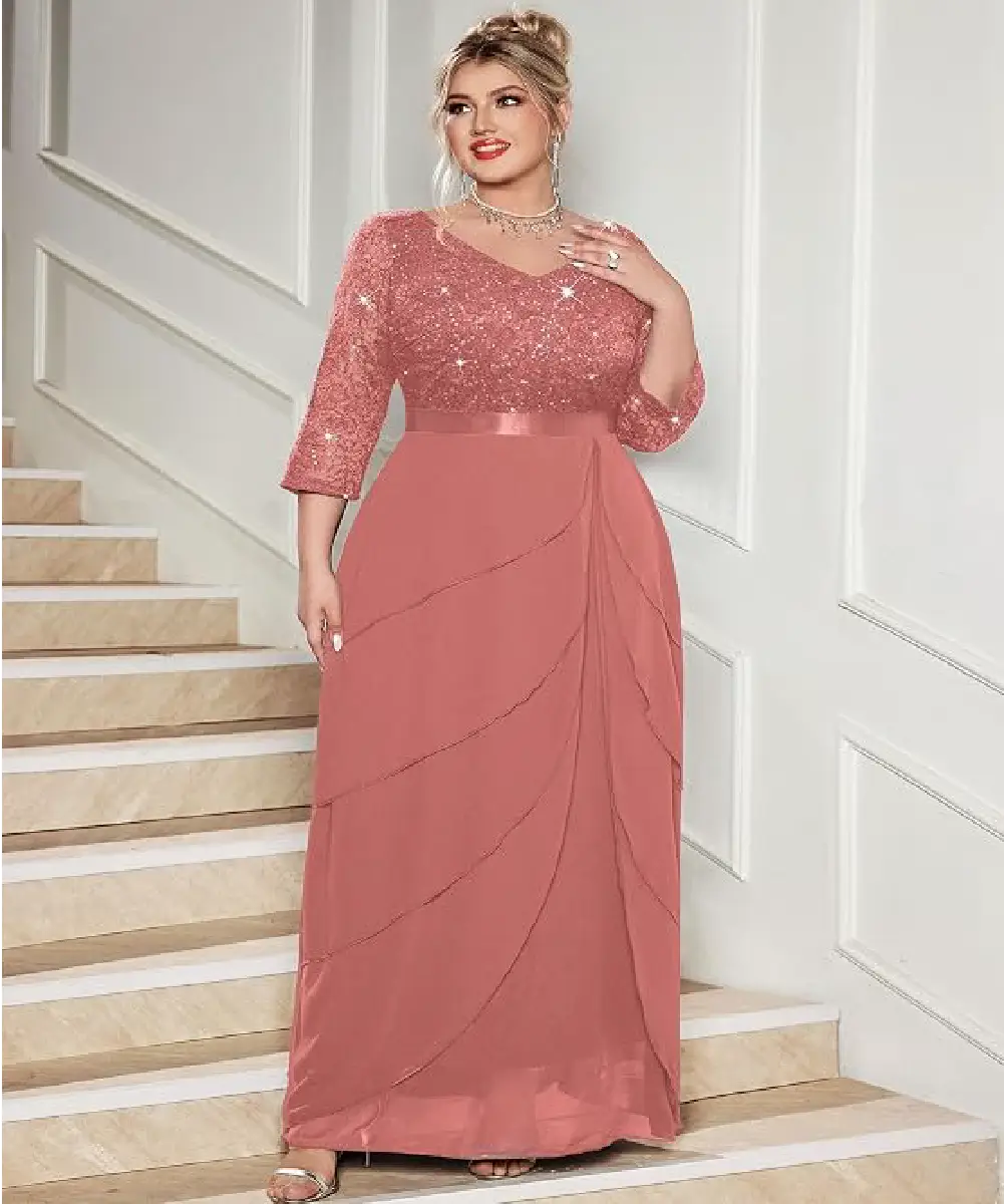 A plus-size woman wearing an elegant dusty rose evening maxi dress with sequin lace bodice, 3/4 sleeves, and a multi-tiered ruffle hemline.