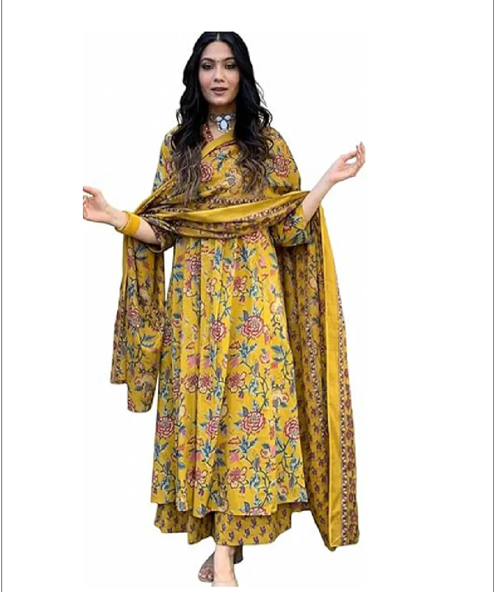 A woman wearing a mustard-colored Anarkali-style calf-length kurta with floral prints, paired with matching pants and a printed dupatta.