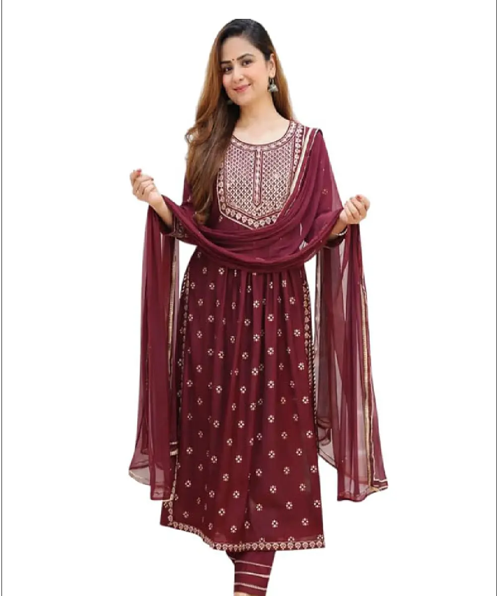 A woman wearing a maroon A-line Naira cut kurta featuring an embroidered yoke and floral print, paired with coordinated pants and a matching dupatta.
