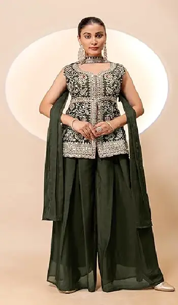 A woman wearing a sophisticated 3-piece dark green ethnic set featuring a sleeveless peplum-style embroidered kurta with a V-neckline and flowy wide-leg palazzo sharara pants.