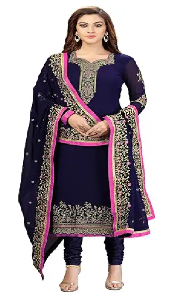 A woman wearing a vibrant teal green georgette Anarkali-style kurta with detailed embroidery, paired with matching pants and a decorative dupatta.