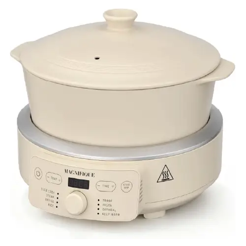 Front view of a MAGNIFIQUE beige 8-in-1 multi-cooker featuring a pure kaolin clay pot and lid, a digital control panel, and a central control knob.