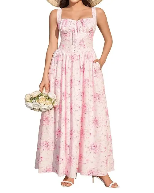 Woman wearing a light pink floral sleeveless maxi dress with a sweetheart neckline, ruched bust, and button-front detailing.