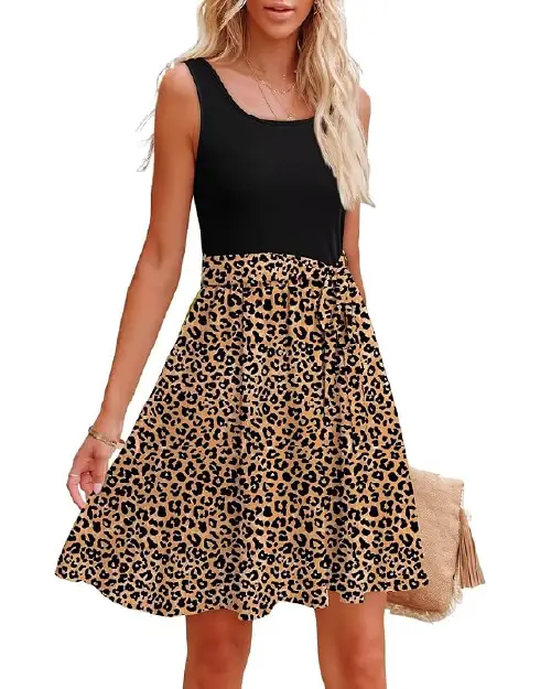Woman wearing a black sleeveless tank top bodice paired with a leopard print flared skater skirt.