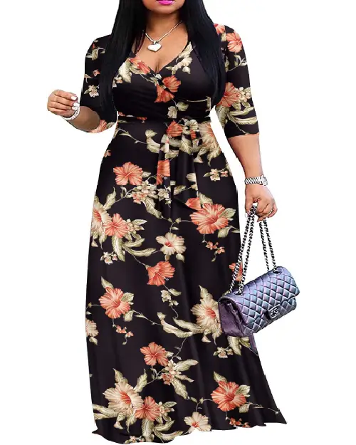 Woman wearing a black V-neck three-quarter sleeve maxi dress featuring an orange floral print and a waist tie.