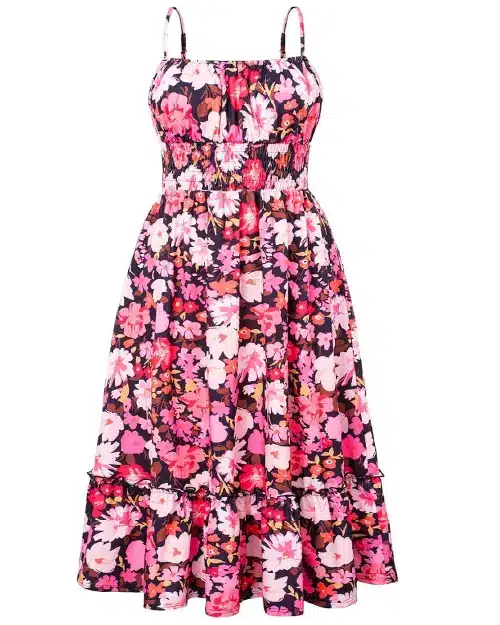 Sleeveless dark navy blue midi dress patterned with vibrant pink and red floral designs, a smocked bodice, and a ruffled hem.