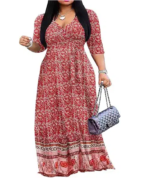 Woman wearing a red floral print V-neck wrap maxi dress featuring three-quarter sleeves, a waist tie, and a patterned border hem.