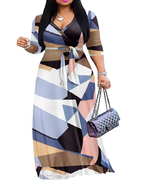 Woman wearing an abstract geometric color-block wrap maxi dress in shades of blue, tan, pink, and white, featuring a waist tie.