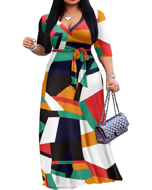 Woman wearing a vibrant multi-color geometric abstract wrap maxi dress in red, green, yellow, navy, and white, featuring a waist tie.