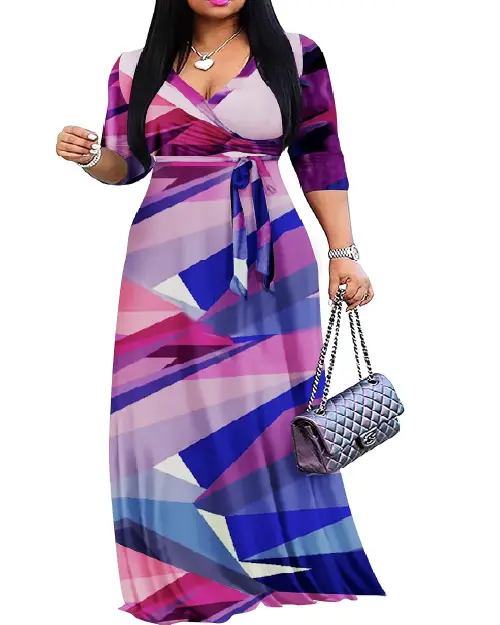 Woman wearing a vibrant geometric abstract wrap maxi dress in shades of purple, pink, and blue, with a waist tie.