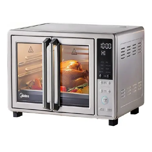 Midea stainless steel double-door countertop oven with a vertical digital display on the right, displaying a roasted chicken and vegetables through the glass panels.
