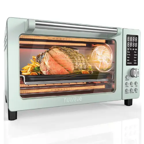 Mint green Nuwave digital countertop convection oven featuring a top digital LED display screen, control buttons, and a dial knob on the right, showing a roasted piece of meat and vegetables inside.