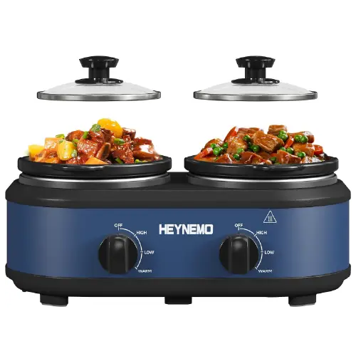 Blue twin-pot slow cooker with dual glass lids and individual control knobs for each heating compartment.