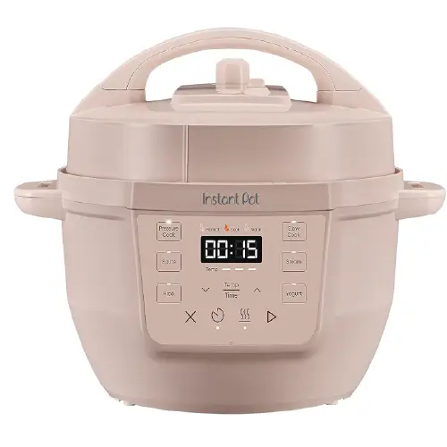 Grey silicone electric warming mat displayed with multiple dishes of food