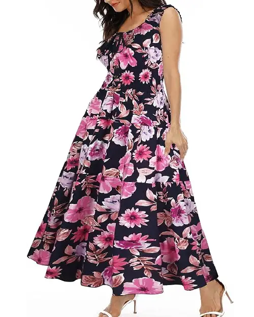 Model in a lavender lilac chiffon maxi dress printed with pink florals, featuring flutter sleeves and a smocked waist.
