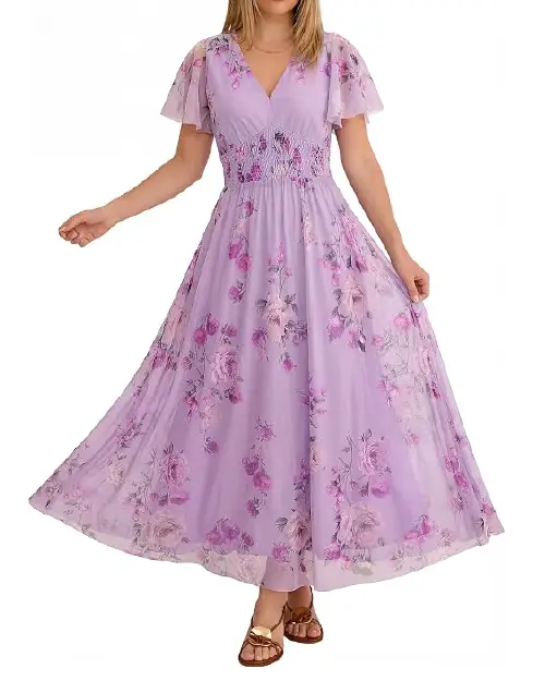 Model in a deep fuchsia pink floral dress featuring a deep V-neckline, layered ruffled tiers, and an asymmetrical skirt hem.