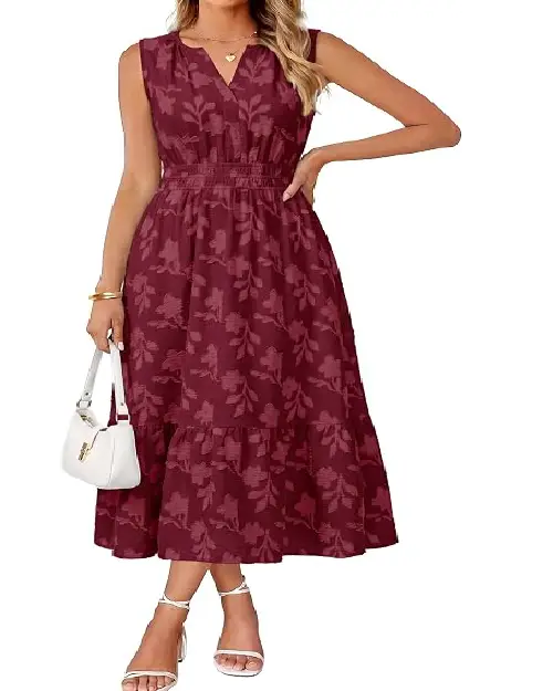Model in a light blush pink sleeveless midi dress featuring a textured floral pattern and a smocked elastic waistband.