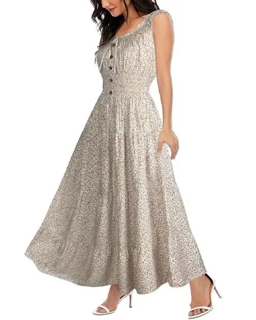 Model in a beige and grey ditsy floral print maxi dress featuring a smocked bodice and ruffled shoulder straps.
