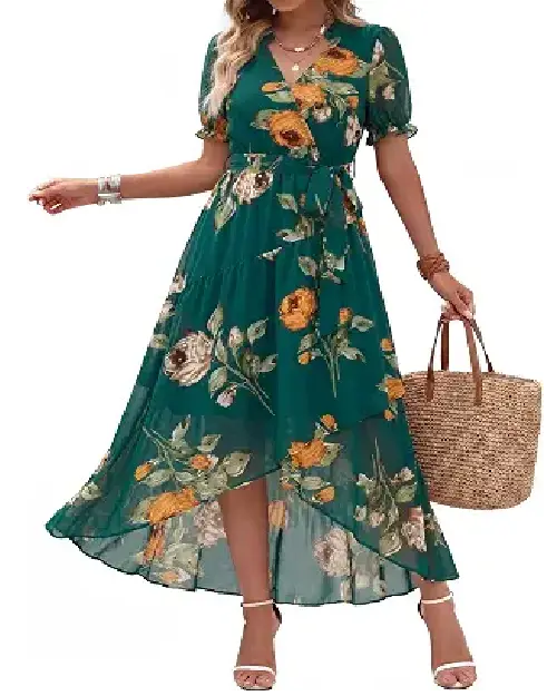 Model wearing an emerald green floral chiffon wrap dress with short puff sleeves, a self-tie waist, and high-low hem, carrying a straw tote.