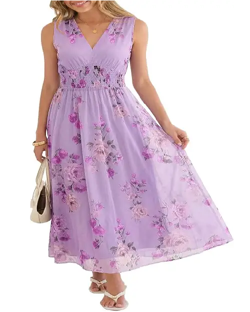 Model in a soft lilac lavender mesh maxi dress featuring subtle floral prints and a cinched smocked waist.