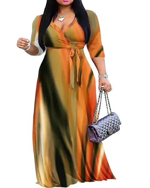 Model in a long wrap maxi dress featuring an abstract earth-tone watercolor print in orange, olive green, and yellow hues with a side tie waist.