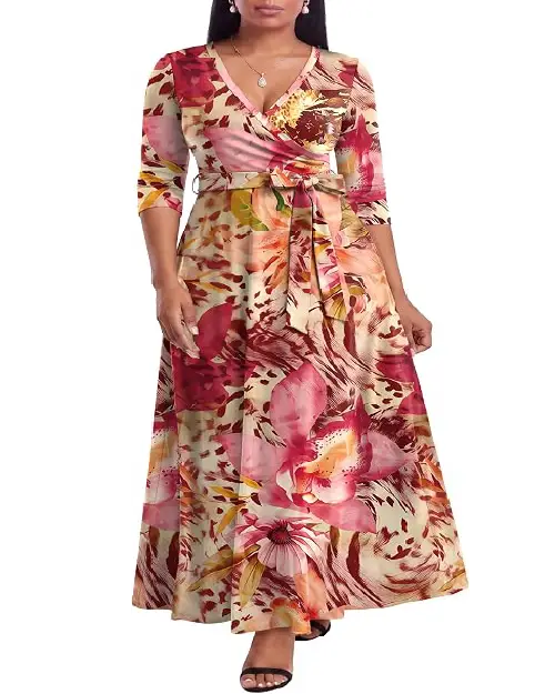 Model in a cream and pink floral print wrap maxi dress featuring large orchid motifs, three-quarter sleeves, and a tied waist belt.