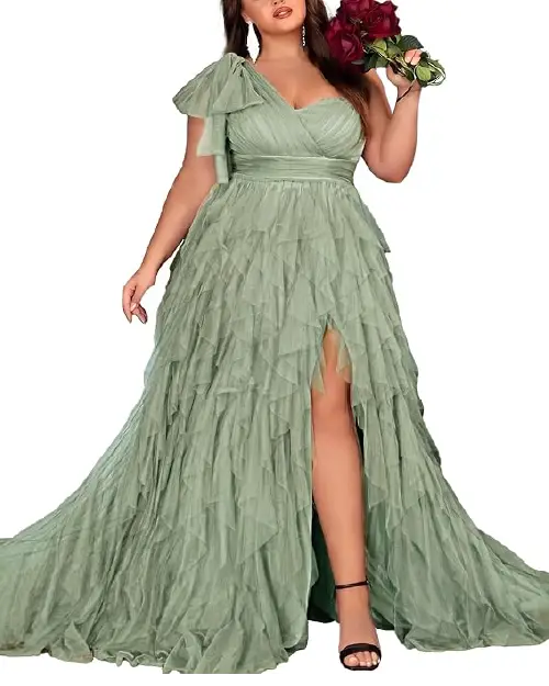 Sage green one-shoulder tulle maxi dress featuring layered ruffles, a bow shoulder accent, and a high front slit.