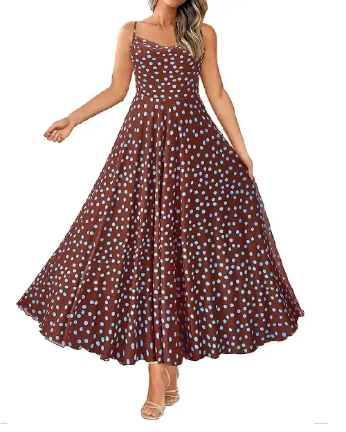 Woman wearing a sleeveless brown maxi dress decorated with small sky-blue polka dots, featuring a fitted bodice and a dramatically flared A-line skirt.