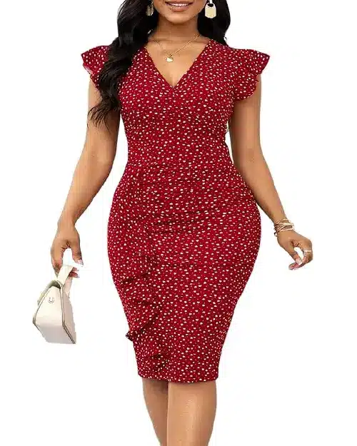 Woman posing in a crimson red midi dress adorned with white polka dots, featuring flutter sleeves and side ruffle details.