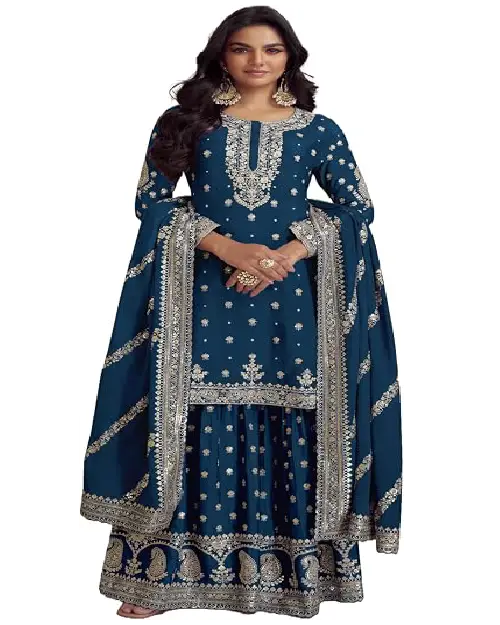 Deep teal blue sharara suit with delicate silver embroidery and a matching sheer dupatta.
