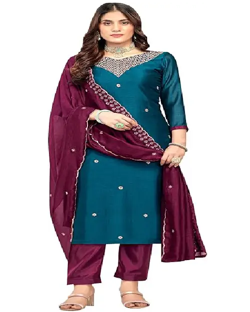 A woman modeling a pastel pink, calf-length rayon kurta featuring a delicate floral print, 3/4 sleeves, and a matching dupatta.