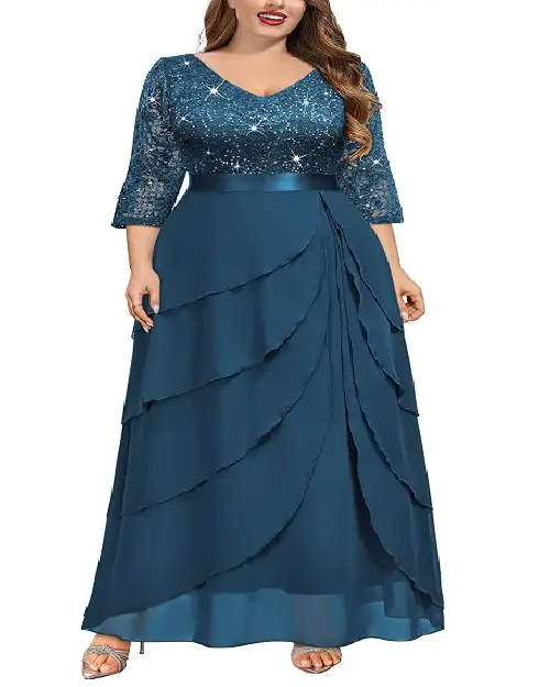 Teal blue tiered georgette evening gown with a sparkling sequined bodice and a satin waistband.