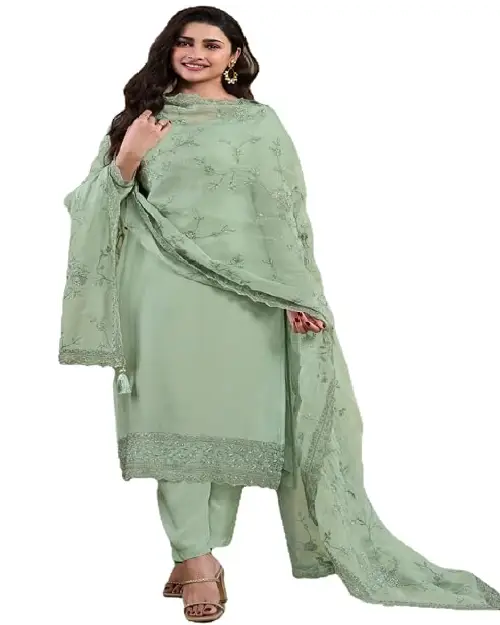 Mint green georgette salwar suit featuring delicate tonal embroidery on the hem and a matching sheer dupatta.