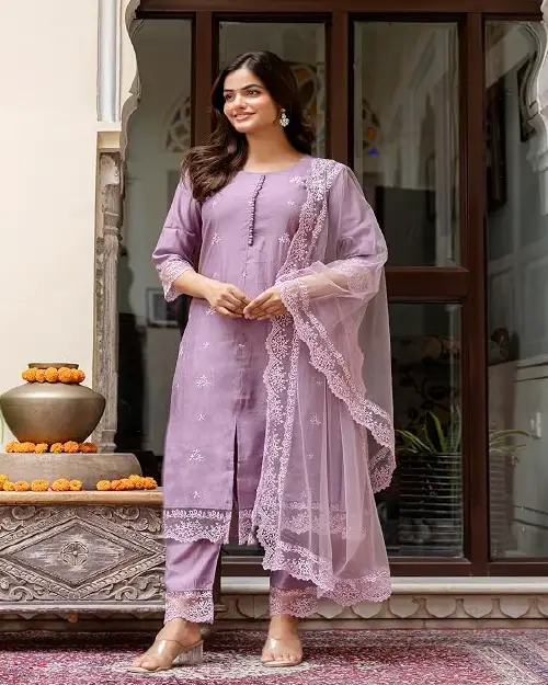 Soft lavender cotton-silk straight cut suit featuring delicate white thread embroidery on the neckline, hem, and matching dupatta.