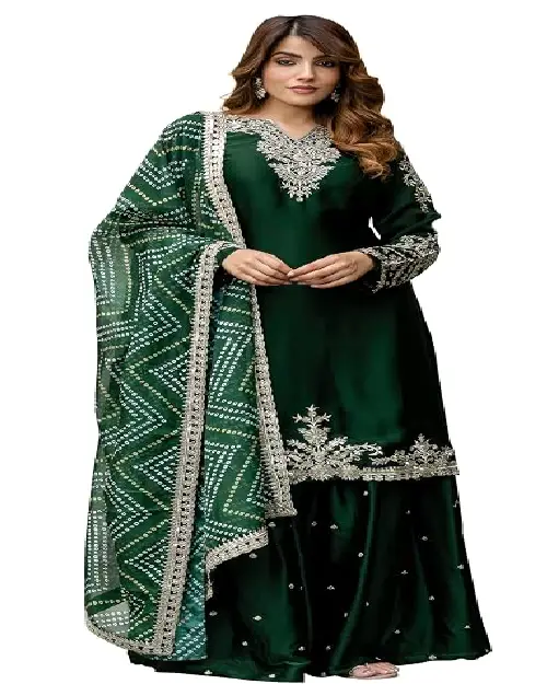 Dark green silk sharara suit featuring traditional Bandhani pattern dupatta and silver embroidery.