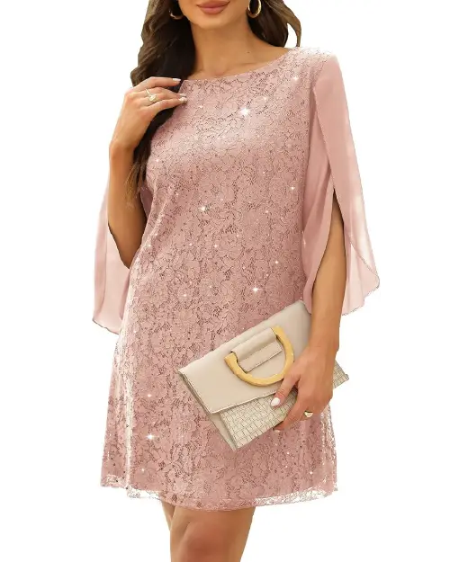 Dusty pink lace cocktail dress paired with a neutral clutch bag.