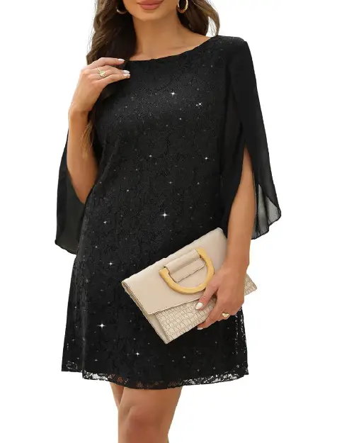 Black lace cocktail dress with sheer split sleeves holding a neutral clutch.