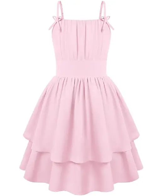 Solid light pink flora dress featuring thin shoulder straps with side bows and a layered tiered ruffle skirt.