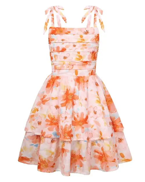 Light pink flora dress featuring a vibrant orange and peach floral print, pleated bodice, and shoulder bow straps.
