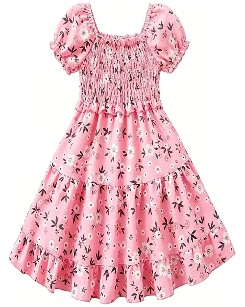 Bright pink flora dress with white and dark leaf floral prints, a smocked bodice, puff sleeves, and a tiered ruffle hem.
