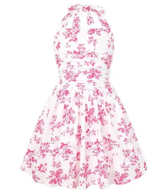 White halter skater dress featuring a hot pink toile botanical floral print, pleated waistband, and a neck bow.