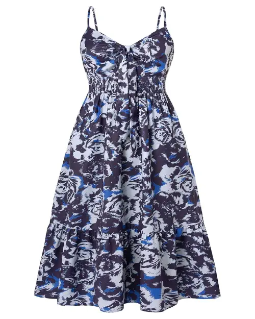 Navy blue and white abstract floral print midi dress with spaghetti straps, a tie-front bodice, a smocked waist, and a tiered hem.