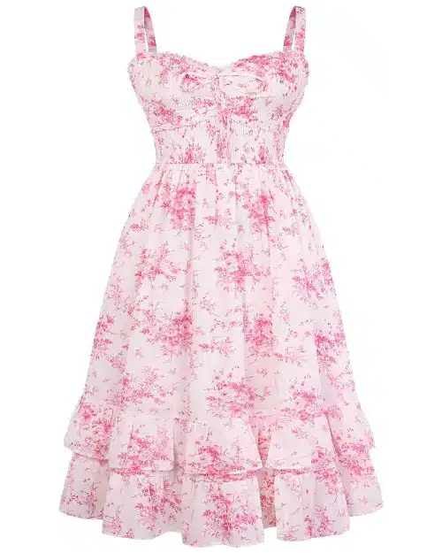 Light pink midi dress with a hot pink toile floral print, featuring thin straps, a smocked bodice with a front tie, and a tiered ruffle hem.