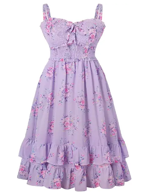 Lavender midi dress with a pink and purple floral print, featuring wide straps, a smocked bodice with a front tie, and a tiered ruffle hem.