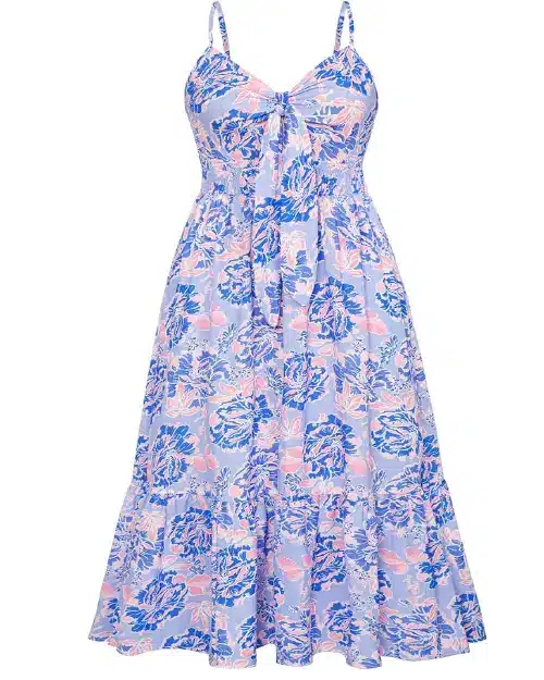 Periwinkle blue midi dress with a blue and pink floral print, featuring spaghetti straps, a tie-front bodice, a smocked waist, and a tiered skirt.