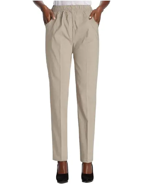 A person wearing light beige straight-leg work pants for women with an elastic waistband and side pockets.