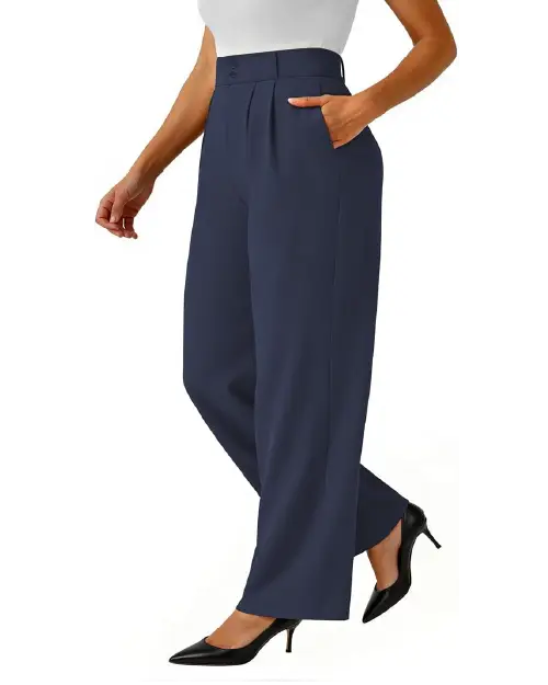 A person wearing dark navy blue high-waisted wide-leg work pants for women with front pleats, side pockets, and a front button closure, styled with black high heels.