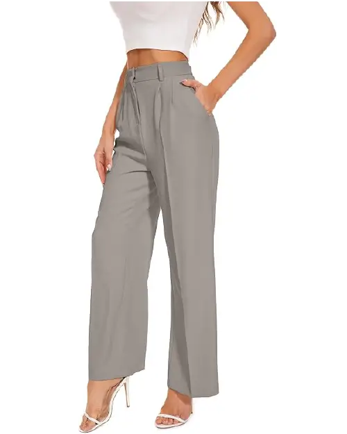 A person wearing taupe-gray high-waisted wide-leg work pants for women featuring front pleats, a button waistband, and side pockets.